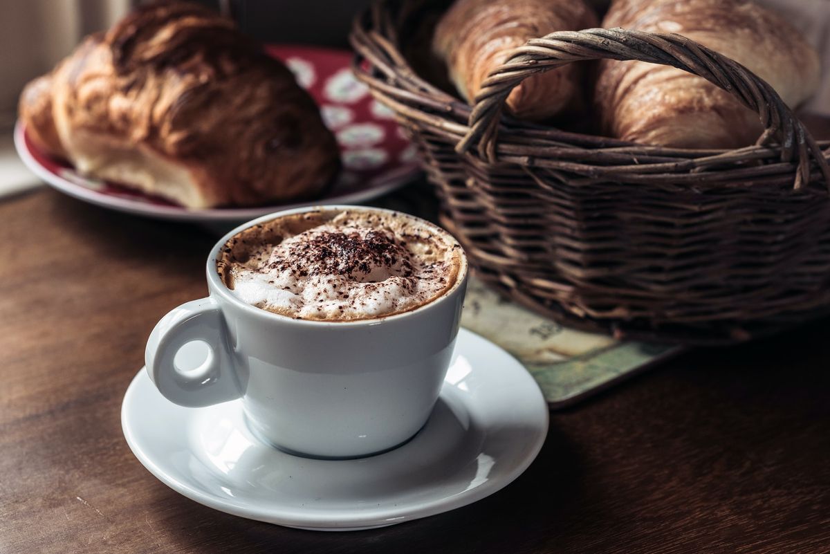 Pasties and coffee on a wooden table